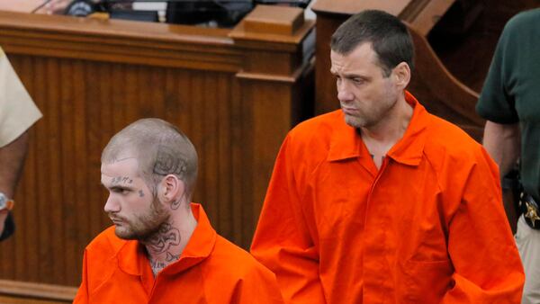 Eatonton, GA - Ricky Dubose (front) and Donnie Russsell Rowe enter the Putnam County courthouse last June for their first court apperance after they were re-captured. BOB ANDRES /BANDRES@AJC.COM