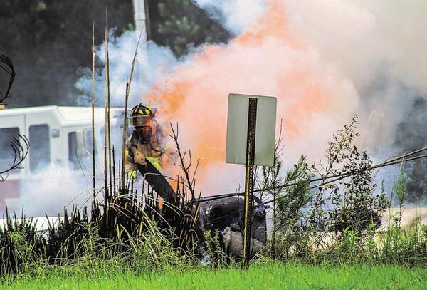 A Georgia man and his 10-year-old grandson were able to escape this fiery weekend crash unharmed. (Credit: Mitch Sneed / Alexander City Outlook)