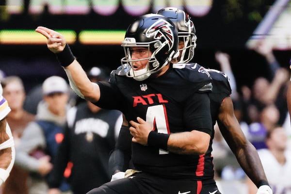 Falcons quarterback Taylor Heinicke (4) reacts after a first down during the fourth quarter against the Minnesota Vikings on Sunday, November 5, 2023, at Mercedes-Benz Stadium in Atlanta. 
Miguel Martinz/miguel.martinezjimenez@ajc.com