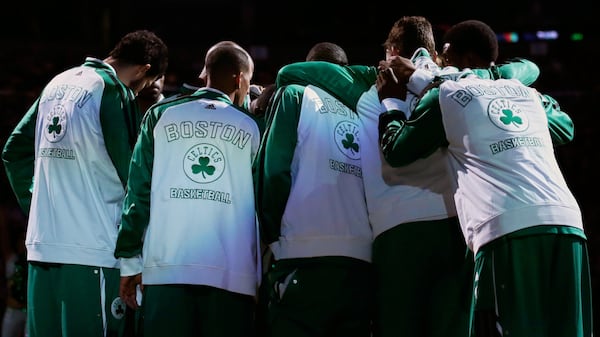 FILE - Boston Celtics players huddle before an NBA basketball game, in Boston, Friday, Nov. 15, 2013. (AP Photo/Charles Krupa, File)