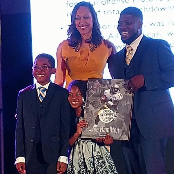 Georgia Tech legend Joe Hamilton with his family (wife Kenya, son Skylar and daughter Kayden) at the induction ceremony this past February for the Atlanta Sports Hall of Fame. (Courtesy Joe Hamilton)