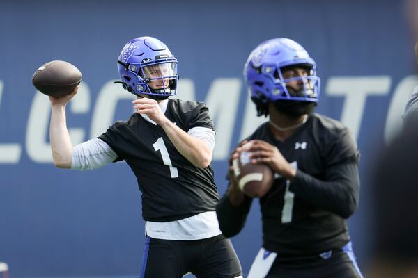 Georgia State quarterback Zach Gibson (1, left) and quarterback Braylen Ragland (7) warm-up during the first day of spring football practice at Center Parc Stadium, Tuesday, February 13, 2024, in Atlanta. (Jason Getz / jason.getz@ajc.com)