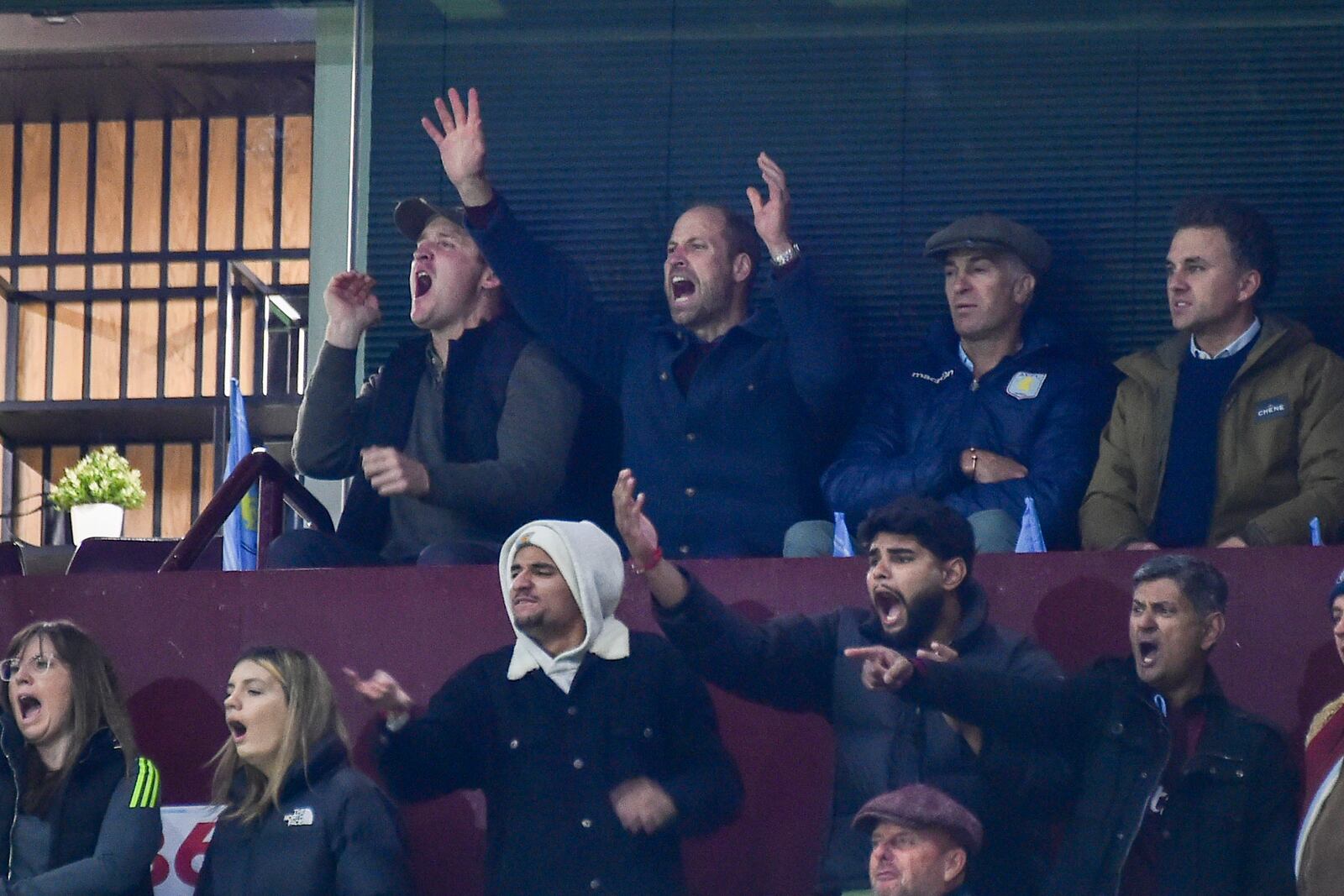 Britain's Prince William, second left in back row, reacts during the Champions League opening phase soccer match between Aston Villa and Bayern Munich, at Villa Park in Birmingham, England, Wednesday, Oct. 2, 2024. (AP Photo/Rui Vieira)