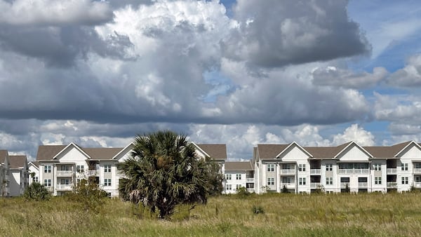 The newly-constructed The Brightly Apartments rises from what was formally a citrus grove nearby Haines City, Florida Saturday, Oct. 5, 2024. (AP Photo/Mike Schneider)