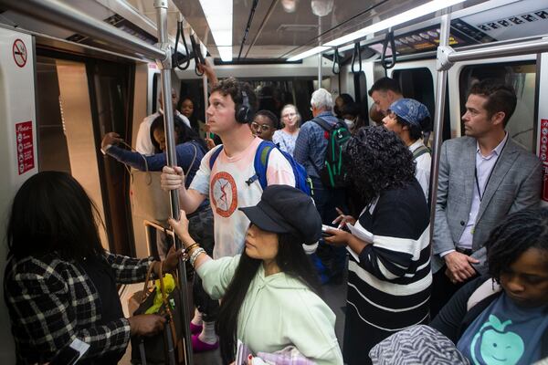 Travelers ride on the plane train on Friday, Dec. 9, 2022, at Hartsfield Jackson International airport in Atlanta.  CHRISTINA MATACOTTA FOR THE ATLANTA JOURNAL-CONSTITUTION.