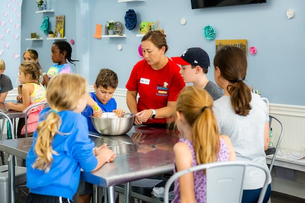 Children get hands-on cooking tips at the Flour Power Cooking Studios in Alpharetta. 
Photo: Courtesy of Alpharetta Convention & Visitors Bureau / Lauren Hubbard