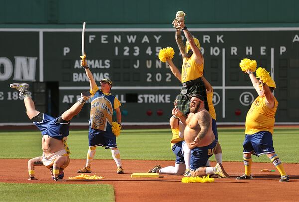 The Savannah Bananas took their World Tour to a sold-out Fenway Park on Saturday, June 8, 2024, as they played the Party Animals before over 37,000 fans in Boston. The Dad Bod Cheerleading Squad performs at second base. (John Tlumacki/The Boston Globe)