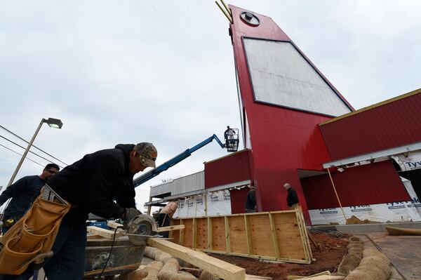 The Big Chicken got a fresh coat of paint Wednesday, March 22, 2017. Marietta's roadside icon at 12 Cobb Parkway is being renovated.