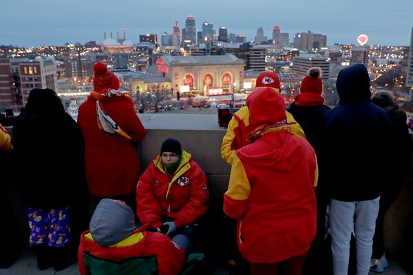 People gather at the Liberty Memorial as they wait for a parade through downtown Kansas City, Mo.