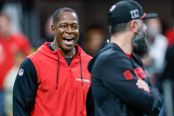 Falcons head coach Raheem Morris interacts with a Falcons staffer moments before the game against the Los Angeles Chargers on Sunday, December 1, 2024, at Mercedes-Benz Stadium in Atlanta. 
(Miguel Martinez/ AJC)