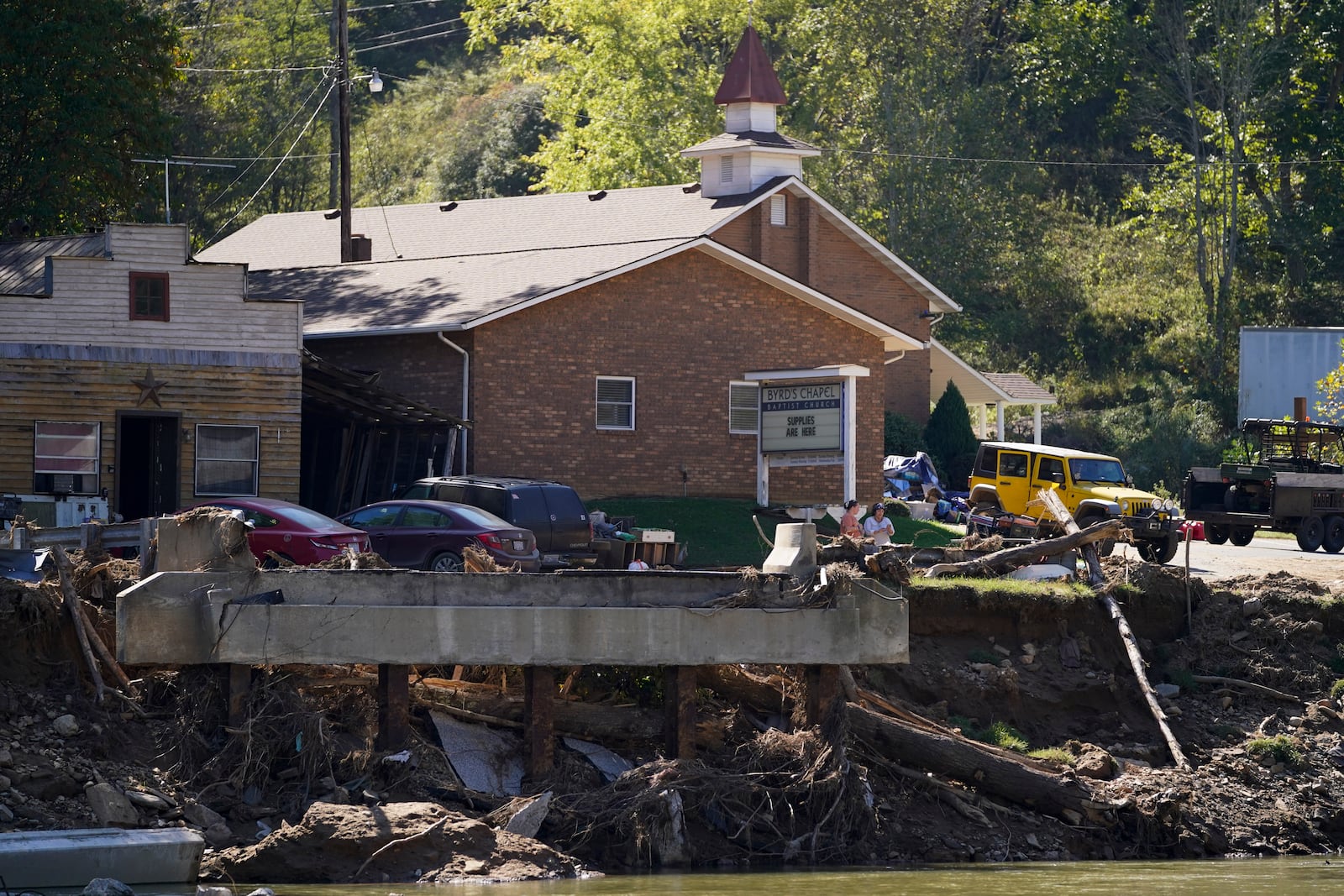 Byrd's Chapel Baptist Church stands across a debris field in the aftermath of Hurricane Helene on Tuesday, Oct. 8, 2024, in Burnsville, N.C. (AP Photo/Erik Verduzco)