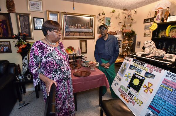 December 8, 2017 Atlanta - Catherine Leach-Bell (left) and Larry Bell show a board they made to appeal their son’s murder case at their apartment home in Atlanta on Friday, December 8, 2017. Catherine Leach-Bell, one of the mothers in the Atlanta Child Murders cases around 1980. Her son, Curtis Walker, 13, was found dead of “asphyxiation/strangulation” March 6, 1981, in the South River near Flat Shoals Road. His case has often been pinned, loosely and without charges, on Wayne Williams. Williams is doing life for murdering two adults in Fulton, but police said they believed he also was responsible for all the nearly 30 child deaths. HYOSUB SHIN / HSHIN@AJC.COM