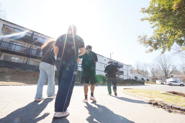 Canvassers with the Georgia Latino Alliance for Human Rights move between buildings in a Latino neighborhood  on Saturday, March 1, 2025, to share information about how to interact with ICE agents in case they come to residents' doors.
(Miguel Martinez/ AJC)