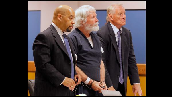 Claud "Tex" McIver stands with his attorneys, William Hill (left) and Steve Maples in this August file photo. Both attorneys have withdrawn from the case.