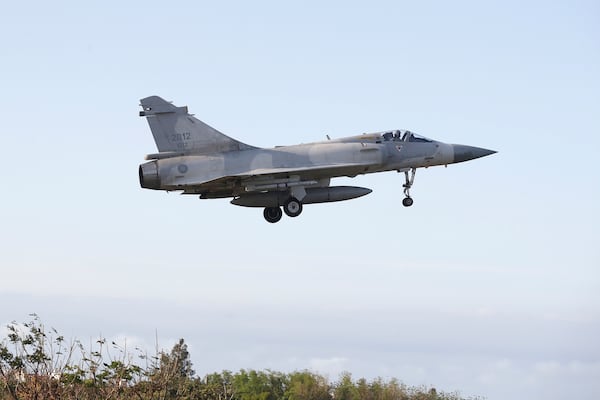 A Taiwan's fighter jet lands at an airbase in Hsinchu, northern Taiwan, Tuesday, Dec. 10, 2024, as Taiwan's Defense Ministry said it detected Chinese naval ships and military planes engaged in training. (AP Photo/Chiang Ying-ying)