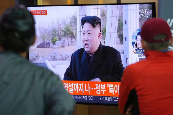 People watch a TV showing a file image of North Korean leader Kim Jong Un during a news program at the Seoul Railway Station in Seoul, South Korea, Saturday, May 2, 2020. Kim made his first public appearance in several weeks as he celebrated the completion of a fertilizer factory near Pyongyang, state media said Saturday, ending an absence that had triggered global rumors that he was seriously ill. (AP Photo/Ahn Young-joon)