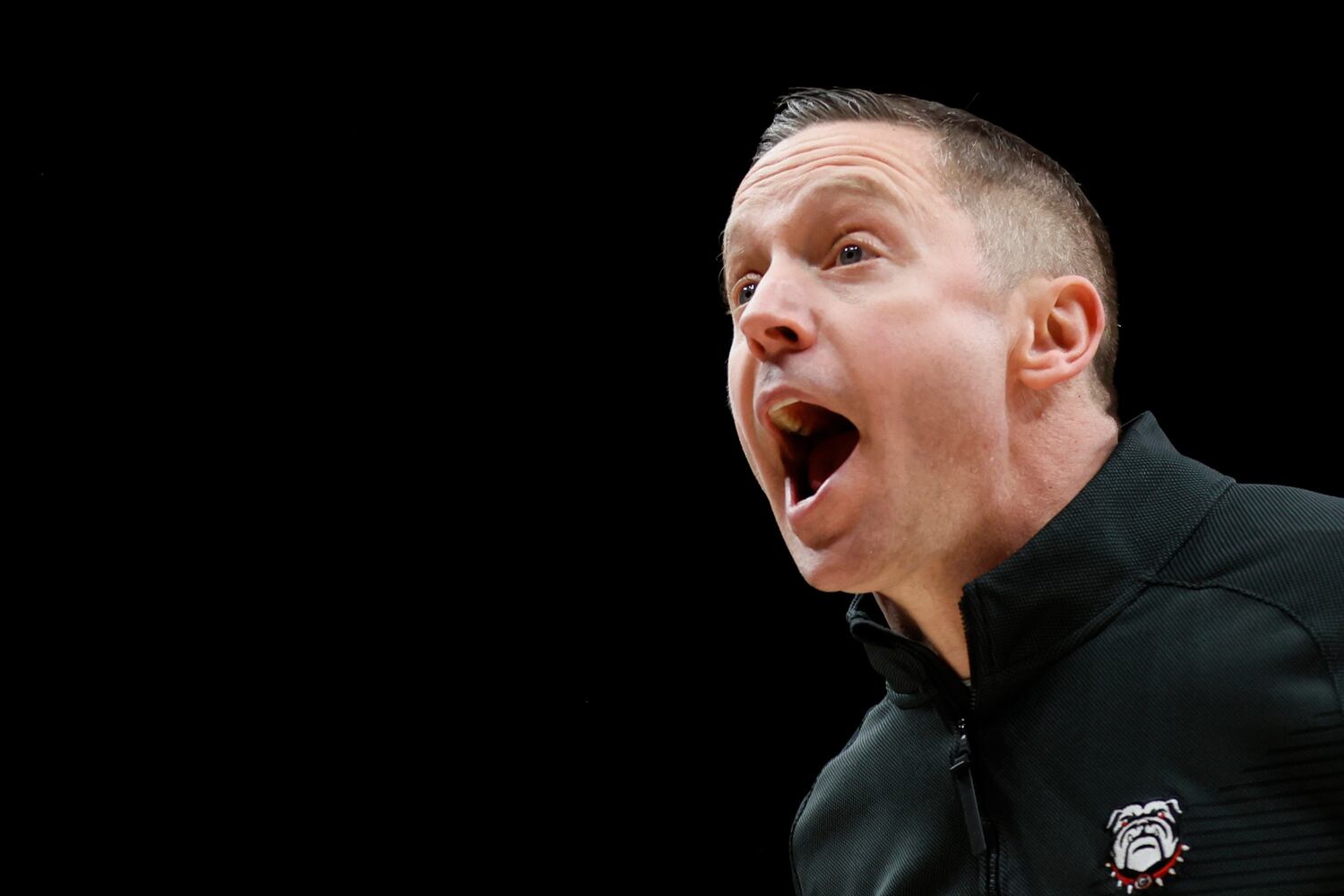 Bulldogs coach Mike White yells instructions during the second half Sunday night at State Farm Arena. (Miguel Martinez / miguel.martinezjimenez@ajc.com)