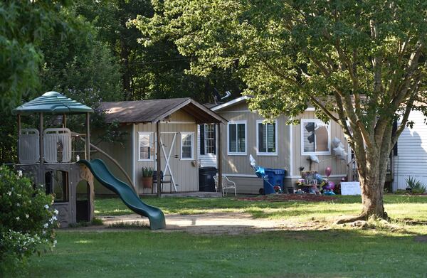 The playset where children gather in the neighborhood stands in front of the Martinez-Romero house. HYOSUB SHIN / HSHIN@AJC.COM