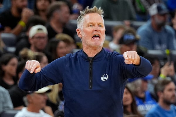 Golden State Warriors head coach Steve Kerr shouts to players on the court during the first half of an NBA basketball game against the Orlando Magic, Thursday, Feb. 27, 2025, in Orlando, Fla. (AP Photo/John Raoux)