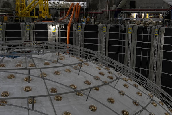 Workers labor near the cosmic detector located 2297 feet (700 meters) underground at the Jiangmen Underground Neutrino Observatory in Kaiping, southern China's Guangdong province on Friday, Oct. 11, 2024. (AP Photo/Ng Han Guan)