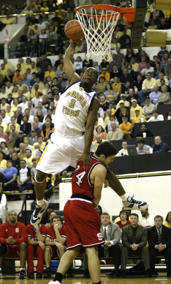 050213 - ATLANTA, GA - (l-r) Georgia Tech Forward#2 Isma'il Muhammad (cq) dunks over North Carolina State's #14 Engin Atsur (cq) during the first half of play at Georgia Tech Sunday night. (BILLY SMITH II/AJC staff)