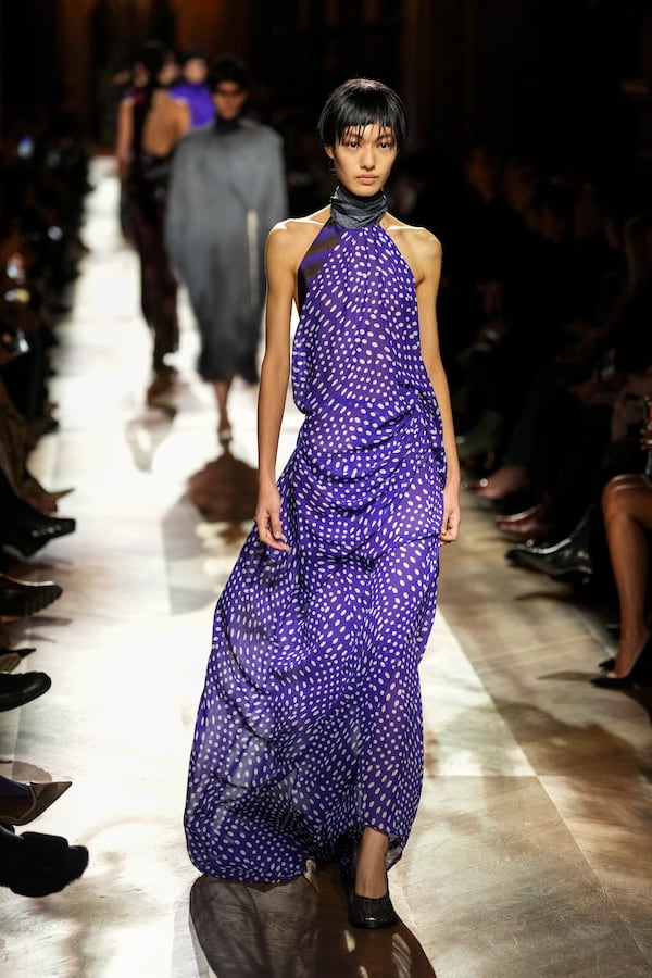 A model wears a creation as part of the Dries Van Noten Fall/Winter 2025-2026 Womenswear collection presented in Paris, Wednesday, March 5, 2025. (Photo by Scott A Garfitt/Invision/AP)