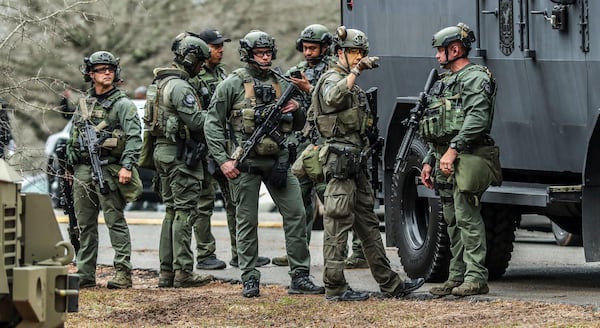 DeKalb and Atlanta SWAT members leaving from Gresham Park command post. Georgia state troopers helping conduct a "clearing operation" at the site of Atlanta's planned public safety training center exchanged gunfire with a protester on Jan. 18, 2023, leaving the protester dead and one trooper wounded, according to the Georgia Bureau of Investigation. (John Spink/The Atlanta Journal-Constitution/TNS)