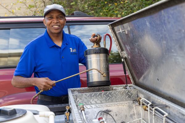 Charles Wangondu owns TFalls pest control. The name pays homage to where he grew up in Kenya: Thomson is known for its waterfall. He has been sending clothes and money back to an orphanage there and improving the schools. (Phil Skinner for the AJC)