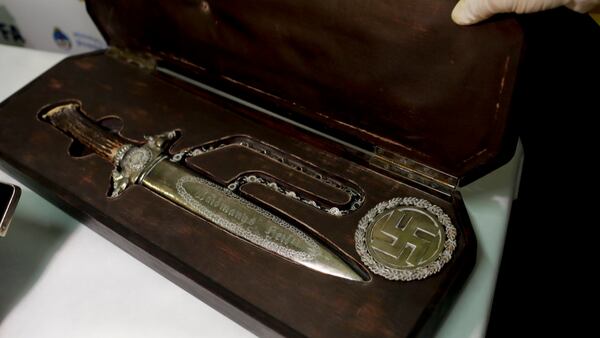 A knife with Nazi markings is seen at the Interpol headquarters in Buenos Aires, Argentina, Friday, June 16, 2017. In a hidden room in a house near Argentina's capital, police discovered on June 8th the biggest collection of Nazi artifacts in the country's history. Authorities say they suspect they are originals that belonged to high-ranking Nazis in Germany during World War II. (AP Photo/Natacha Pisarenko)