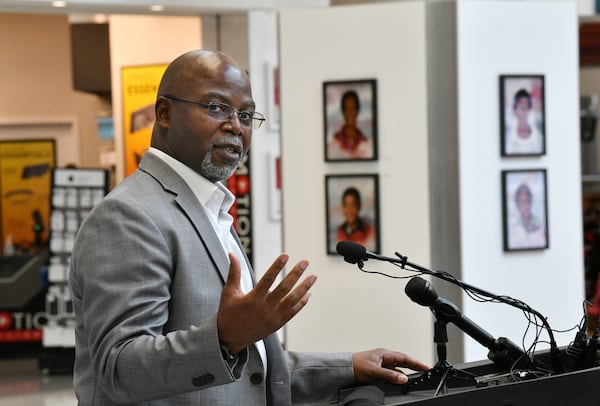 Artist Dwayne Mitchell speaks during an event to announce the exhibition of the Atlanta Children's Memorial Portraits at Hartsfield-Jackson Atlanta International Airport on Wednesday, June 30, 2021. Artist Dwayne Mitchell was commissioned to create 30 portraits memorializing each victim of the Atlanta Child Murders. (Hyosub Shin / Hyosub.Shin@ajc.com)