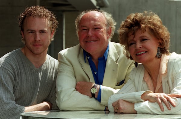 From left, actors Sam West, his father Timothy West and his mother Prunella Scales during a photocall in London, July 15, 1999. (Michael Crabtree/PA via AP)