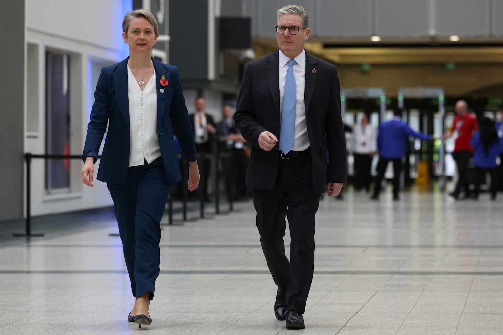 British Prime Minister Keir Starmer, right, and Home Secretary Yvette Cooper, left, walk at the Interpol General Assembly in Glasgow, Scotland, Britain, Monday, Nov. 4, 2024. (Russell Cheyne/Pool Photo via AP)