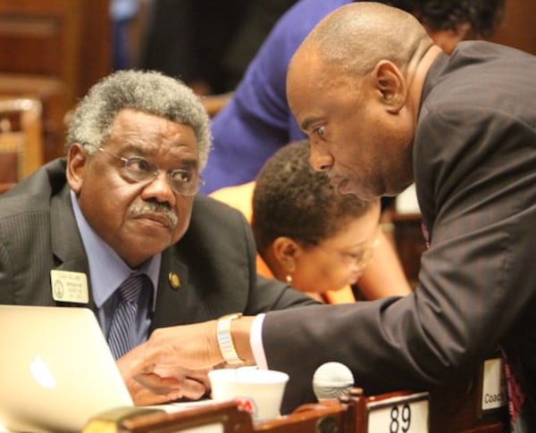 State Rep. Mack Jackson (right) holds a discussion with Rep. Earnest "Coach" Williams during a special legislative session in 2011. Jackson was elected to the House in 2008. (AJC File)