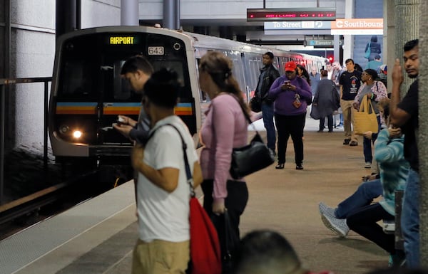 April 3,  2017 - Atlanta - MARTA passengers at Lindbergh Center wait for an arriving southbound train.  Passengers on both the Red and Blues lines were saying parking lots were full.  A portion of I-85 remains closed because of Thursday's fire and bridge collapse. BOB ANDRES  /BANDRES@AJC.COM