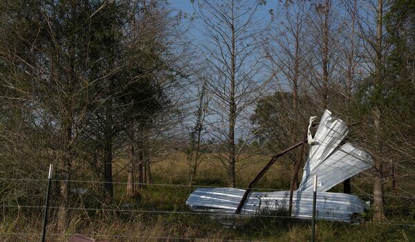 Debris sticks onto trees following a tornado that went through Katy, Texas, Saturday, Dec. 28, 2024. (Elizabeth Conley/Houston Chronicle via AP)