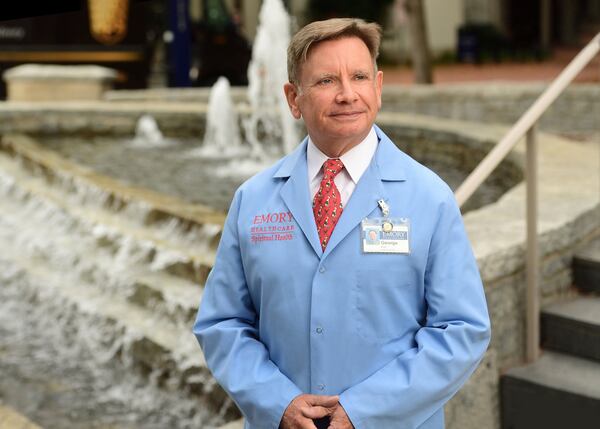 The Rev. George H. Grant wears the blue coat that signals he’s an Emory chaplain. He said the novel coronavirus has put more pressure on hospital staffers, and he’s there to help patients, their families and health care professionals. 