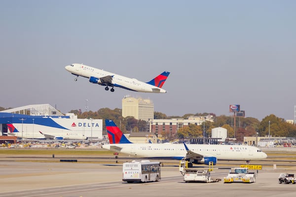 Delta Air Lines jets depart and arrive at Hartsfield-Jackson International Airport on Nov. 8, 2023. AJC 2023