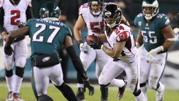 Falcons running back Devonta Freeman looks for running room against the Eagles Saturday, Jan. 13, 2018, in Philadelphia.