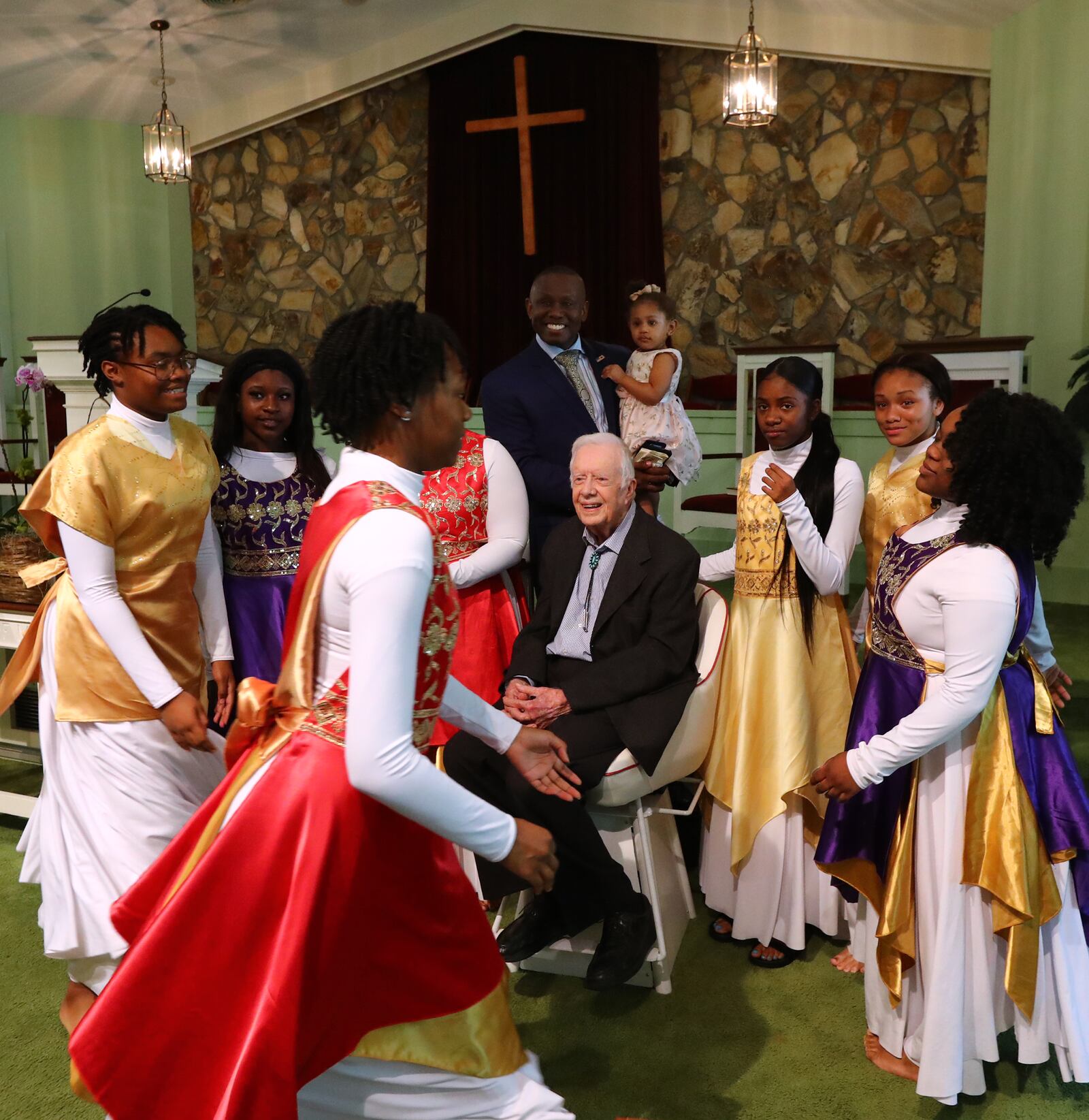 Former President Jimmy Carter has his picture taken with the Hayiya Dance Theatre Inc. after they performed during the worship service at Maranatha Baptist Church in Plains on Sunday, June 9, 2019, in Plains. The former president, 94, returned to teach Sunday school less than a month after falling and breaking his hip. (Photo:  Curtis Compton/ccompton@ajc.com)