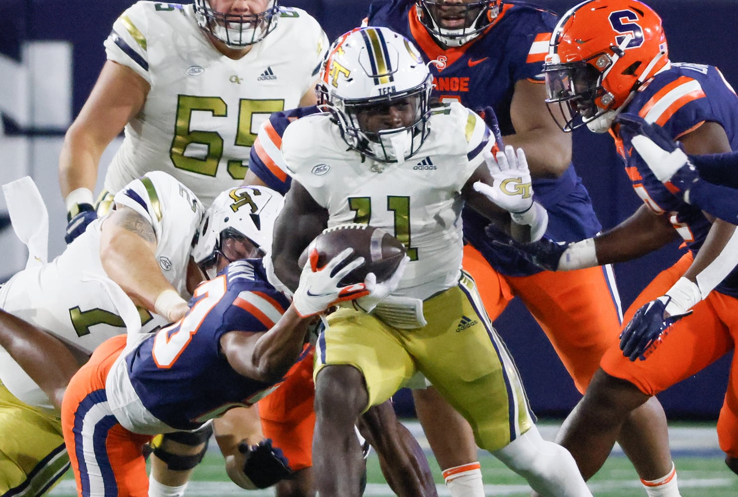 Georgia Tech Yellow Jackets running back Jamal Haynes (11) has the ball stripped after a nice run and fumbles during the second half of an NCAA college football game between Georgia Tech and Syracuse in Atlanta on Saturday, Nov. 18, 2023.  Georgia Tech won, 31 - 22. (Bob Andres for the Atlanta Journal Constitution)