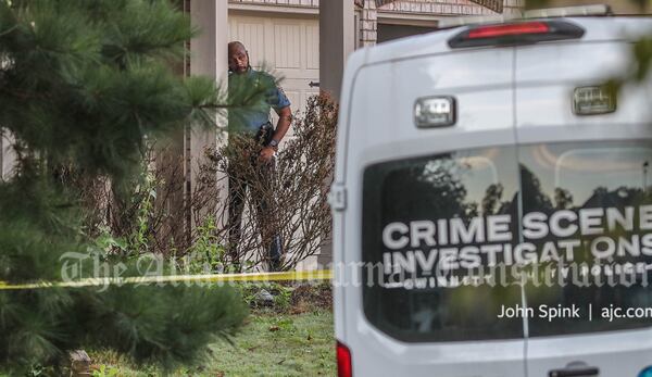 Investigators gathered evidence Thursday morning after a shooting in a subdivision off Huff Road near Lawrenceville.