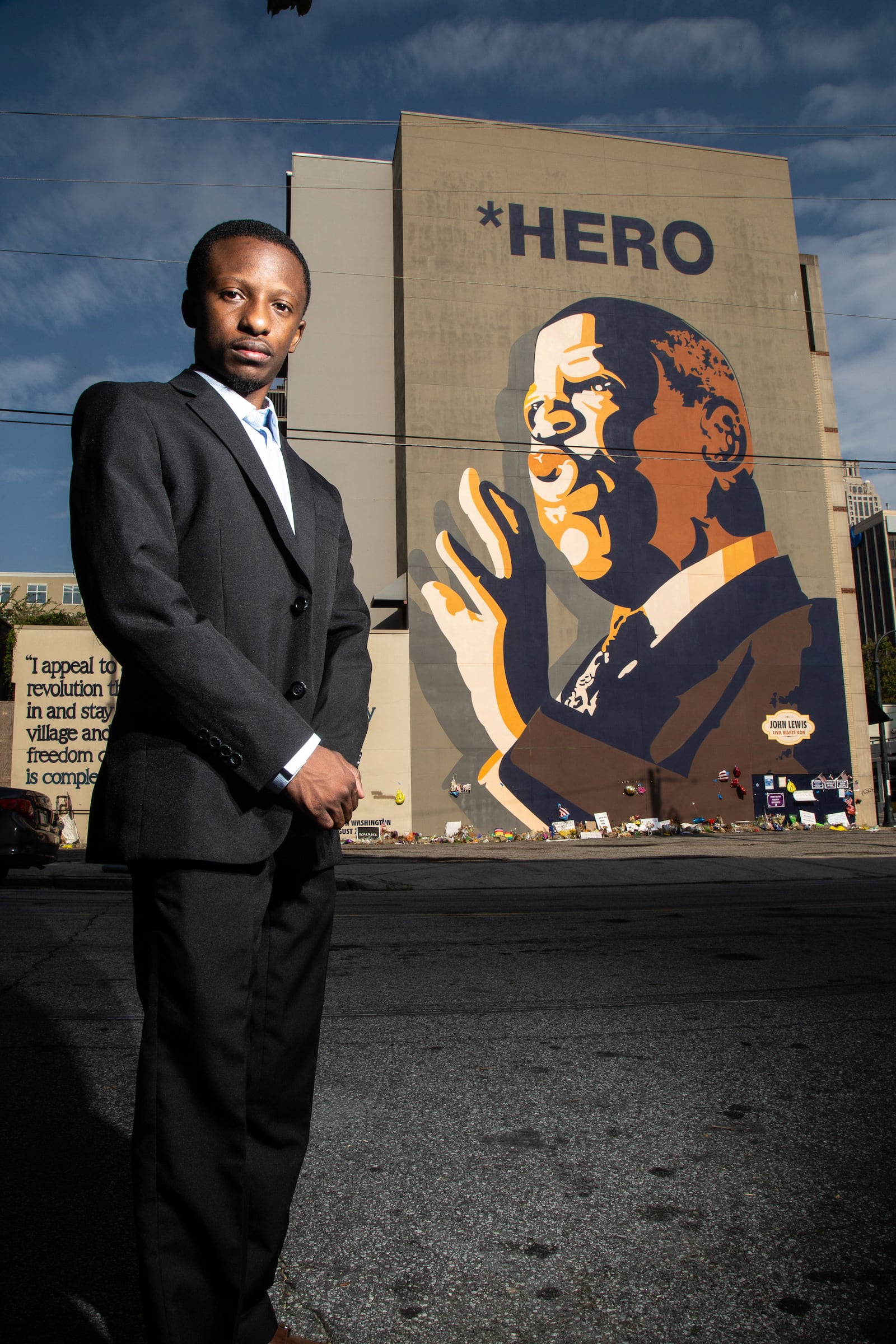 Jared Sawyer poses for a photograph in front of the  John Lewis mural on Auburn Ave in Atlanta, August 6, 2020.  STEVE SCHAEFER FOR THE ATLANTA JOURNAL-CONSTITUTION