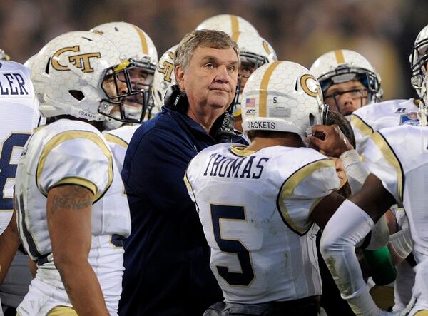 Georgia Tech head coach Paul Johnson, center, talks to his team during a timeout in the first half of the Atlantic Coast Conference championship NCAA college football game against Florida State in Charlotte, N.C., Saturday, Dec. 6, 2014. (AP Photo/Mike McCarn) After 60 frenzied minutes, two points short. (Mike McCarn/AP photo)