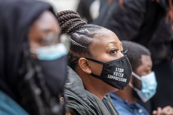 Demonstrators chained together protest HB 531 outside the Georgia Capitol on Day 25 of the legislative session in Atlanta on Monday, March 1, 2021. (Alyssa Pointer / Alyssa.Pointer@ajc.com)