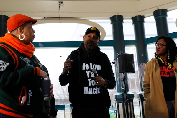 Mawuli Davis from Beacon Hill Alliance for Human Rights (center) speaks about the killing of Tyre Nichols by Memphis police during a candlelight vigil at Decatur Square on Sunday, January 29, 2023. (Photo: Miguel Martinez / miguel.martinezjimenez@ajc.com)