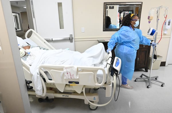 Medical staff transfer a patient at Miller County Hospital. While some other rural Georgia hospitals see few patients, in September more than 130 procedures were performed in the Miller County operating facilities. (Hyosub Shin / Hyosub.Shin@ajc.com)