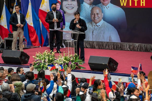 Former President of the Philippines Rodrigo Duterte speaks inside the Southorn Stadium during a thanksgiving gathering organized by Hong Kong-based Filipino workers for the former populist president in Hong Kong on Sunday, March 9, 2025. (AP Photo/Vernon Yuen)