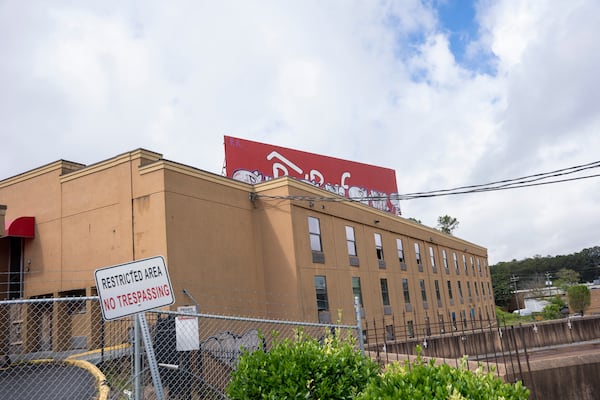 An abandoned hotel deteriorates on land that was recently purchased by the county for redevelopment along Fulton Industrial Blvd in Atlanta, Georgia on Thursday, April 11, 2024. (Olivia Bowdoin for the AJC).