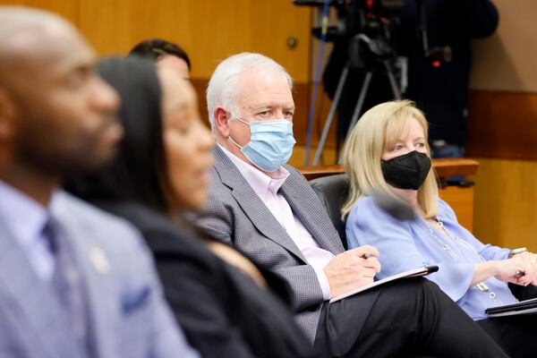 Atlanta Journal-Constitution Editor Kevin Riley and Managing Editor Shawn McIntosh listen to Fulton County Superior Court Judge Robert McBurney during a hearing about the report's results being released to the public. (Miguel Martinez / miguel.martinezjimenez@ajc.com)