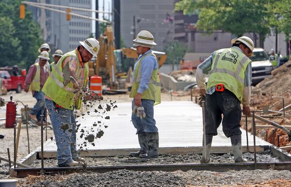 Matthews workers are shown here working on the then-new 14th Street sidewalk Thursday, April 30, 2009.